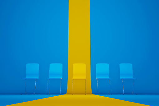 Outstanding chair in row. Yellow chair standing out from the crowd. Human resource management and recruitment business concept. 3d illustration