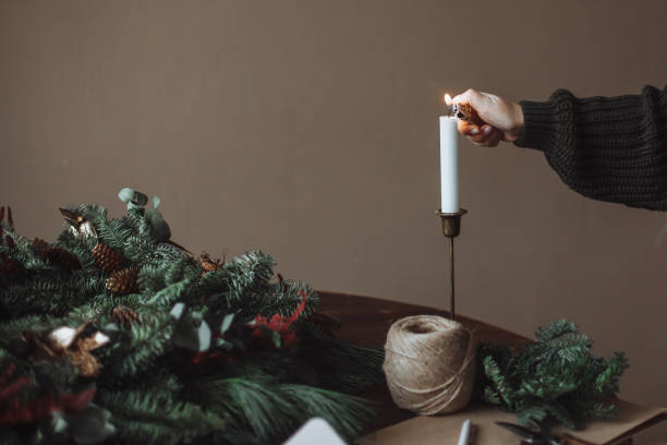 istock Girl lights a candle 1360460975