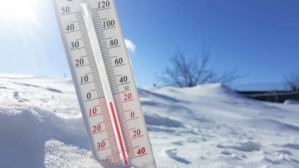 istock Thermometer in winter in the cold on snow and analyzes low negative air temperatures in clear sunny weather.Meteorological conditions and environmental analysis.Climate change on earth.Northern region 1360462608