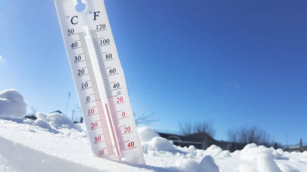 istock Thermometer in winter in the cold on snow and analyzes low negative air temperatures in clear sunny weather.Meteorological conditions and environmental analysis.Climate change on earth.Northern region 1360462621