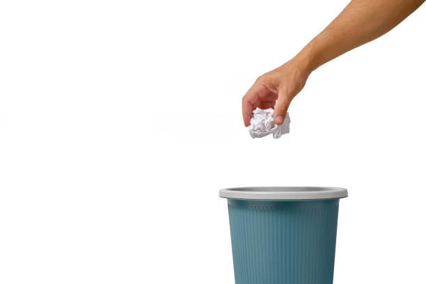istock Sheet crumpled white paper is thrown into trash. 1360467248