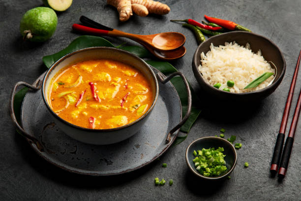 istock Yellow curry with chicken in bowl on dark background. 1360470142