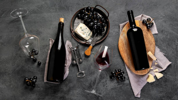 istock Red wine assortment with appetizers on gray background. 1360470212