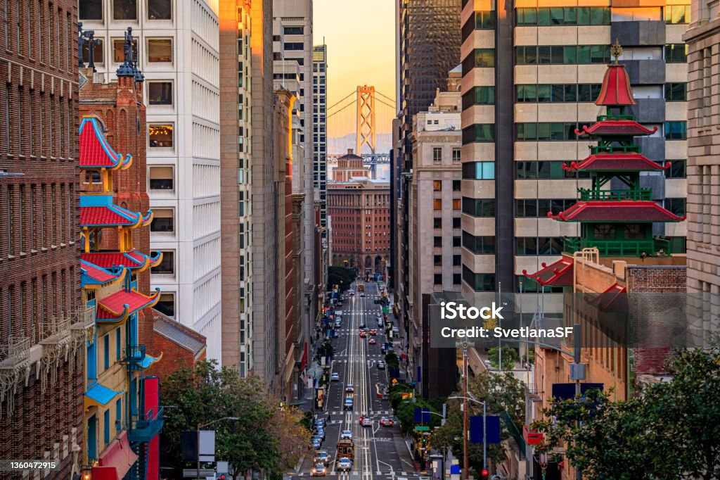California Street near China Town with the Bay Bridge at sunset, San Francisco Famous view of California Street near China Town and the Financial District, with Chinese pagoda towers and the Bay Bridge at sunset in San Francisco San Francisco - California Stock Photo