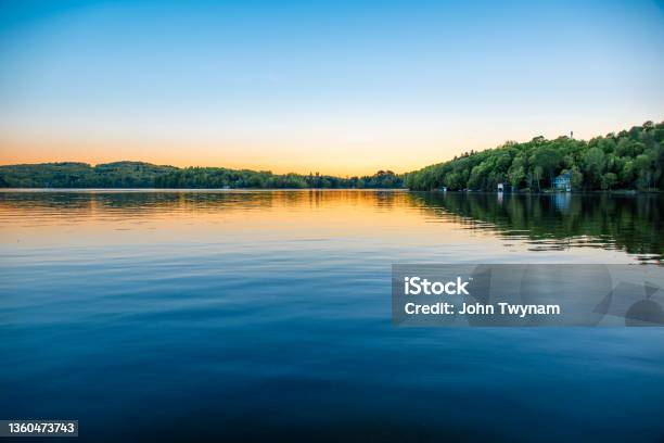 Calm Water On A Clear Night Stock Photo - Download Image Now - Lake, Sunset, Tree