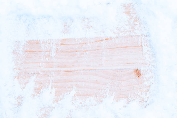 istock Table snow. Winter wooden texture background. Christmas board with old rustic wood wall, white frozen ice. Merry Christmas holiday card pattern. 1360475224