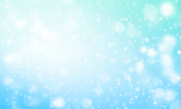 istock White Glitter Lights on Blue Texture Background. White Bokeh. Defocused, Celebration, Christmas Holiday Backdrop. 1360475462