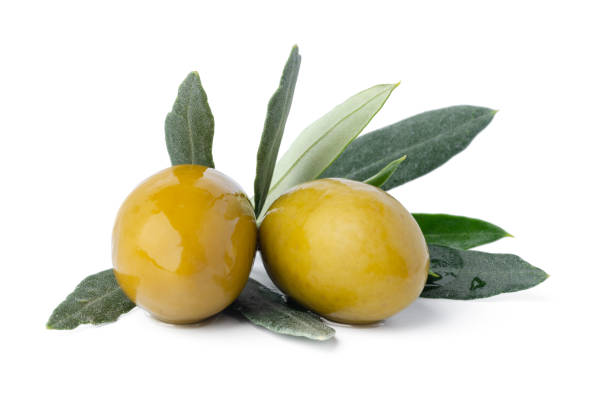 istock Green olives with leaves isolated on white background. 1360475586