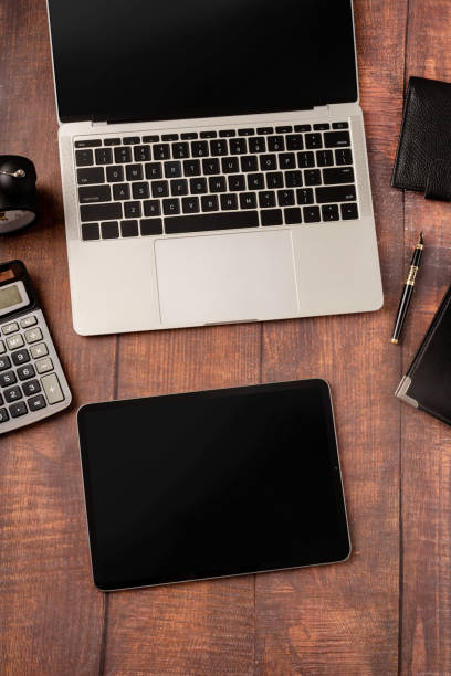 top view desktop blank tablet, laptop and stationery on wooden background - spiral notebook audio imagens e fotografias de stock