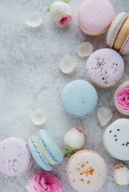 istock Beautiful colorful tasty macaroons on a concrete background 1360479328