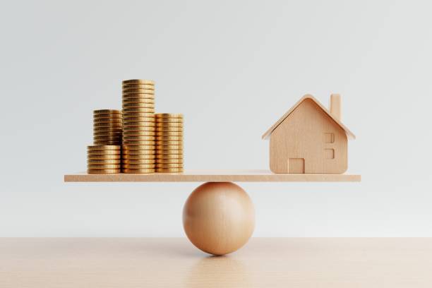 Wooden house and golden coin on balancing scale on white background. Real estate business mortgage investment and financial loan concept. Money-saving and cashflow theme. 3D illustration rendering stock photo