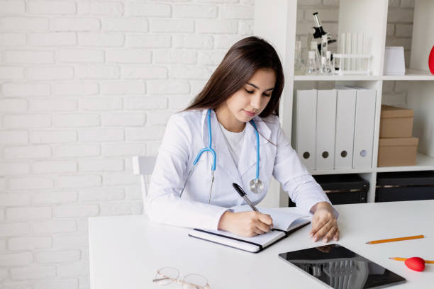 istock Young doctor woman working in the office 1360482284