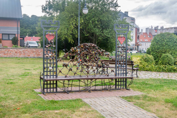 Tczew, Poland - August 26, 2021: Love bench with love padlocks.