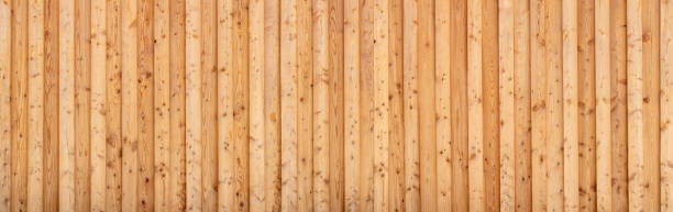 istock Light brown panoramic wooden wall made of spruce wood 1360486086