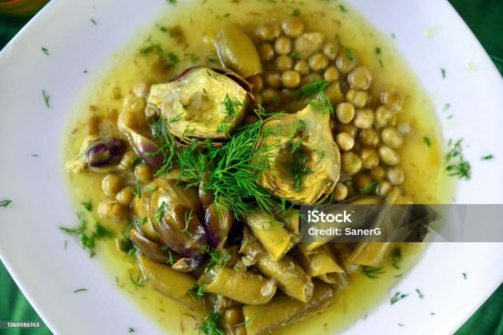 Vegan food; Artichoke with broad bean and peas Artichoke Stock Photo
