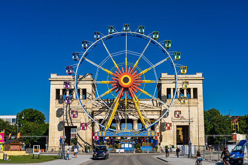 Munich, Germany - Jul 28, 2021: ferris wheel at Konigsplatz - Kings Square, Munich - Bavaria - Munich, Germany