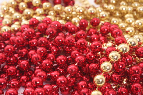 istock Red and Gold Holiday Bead Decortations. Christmas Background 1360487948