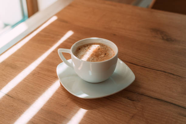 istock First coffee in the morning, coffee cup on the table with copy space 1360493165