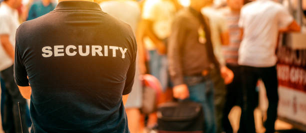 istock Security guard at live festivale event 1360493212