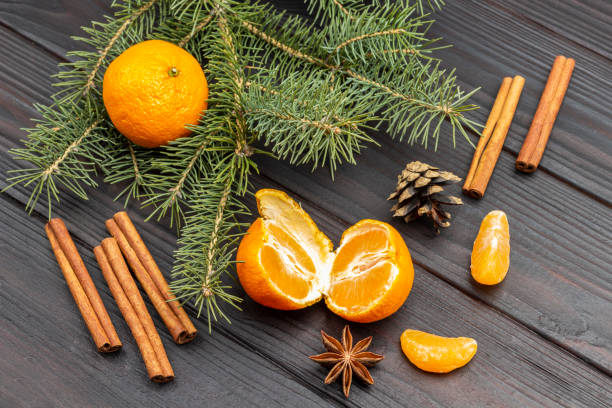 istock Tangerine halves and cinnamon sticks. 1360493457