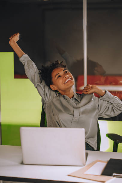 istock Young black woman at her working place in the office 1360494571