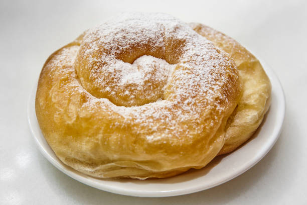 istock Traditional spanish bakery pastry dessert, ensaimada. Mallorca dessert. Spiral shaped 1360495431