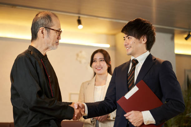 Restaurant owner and sales man shaking hands