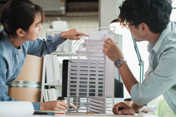 Team architects or engineer designer in office discussing construction project. stock photo