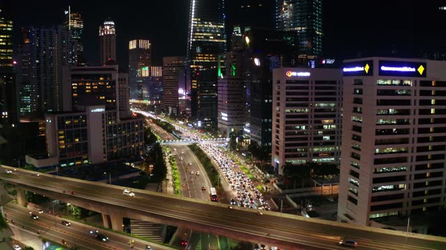 Aerial view of highway with traffic jam at night