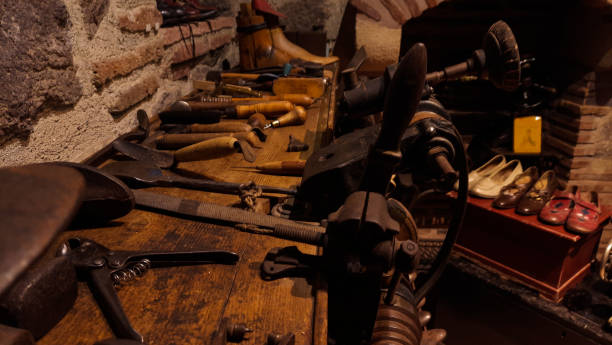 istock Shoe workshop where people worked in the old times and the materials used 1360504204