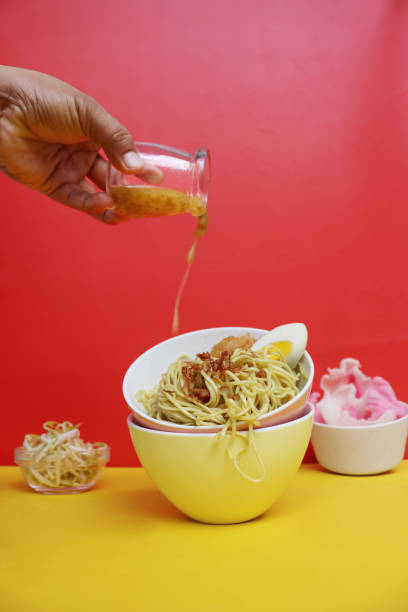 istock broth is poured over the noodles 1360505445