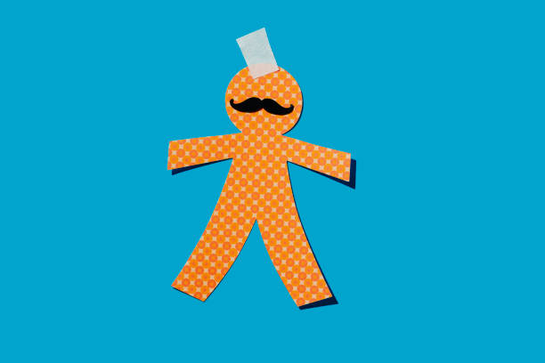 The concept of corporate slavery. A hand controls a worker on a white background. Other people's ideas. Puppet master.