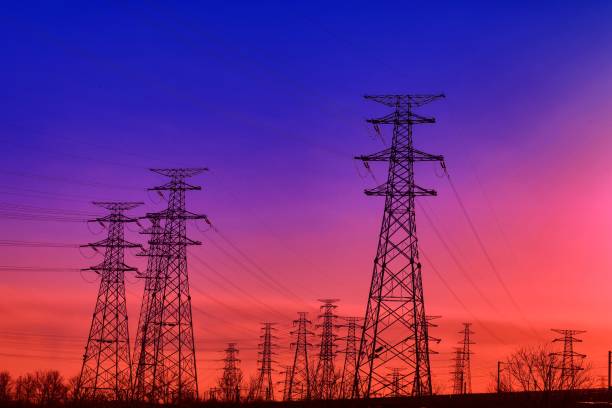 istock Power tower and cables in the sunset 1360506844