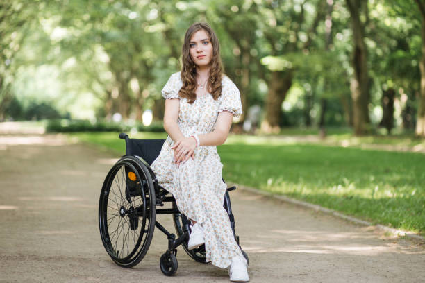 istock Woman with physical disability spending time at park 1360507765