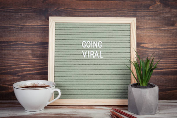istock Going Viral. Coffee mug and colored pencils on the office desk 1360507886