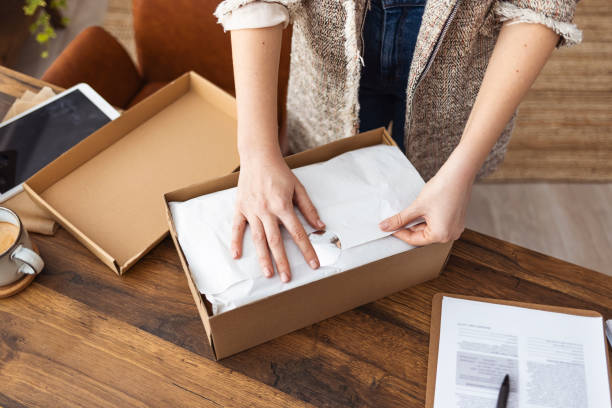 istock Female online seller confirming orders from customer 1360507944