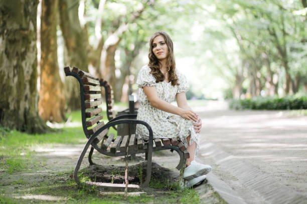 istock Happy woman with disability spending time at summer park 1360507964