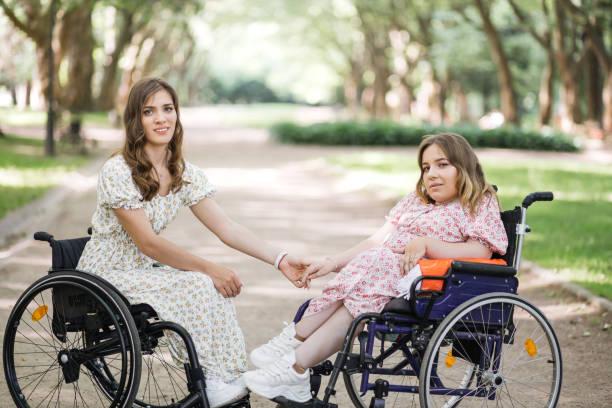 istock Two women with disability enjoying summer at green park 1360508061