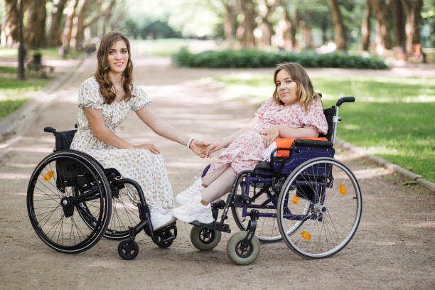 istock Two women with disability enjoying summer at green park 1360508071
