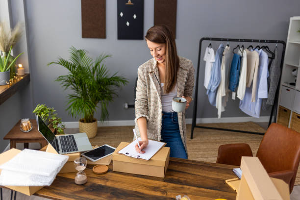 istock Working woman at online shop. 1360512824