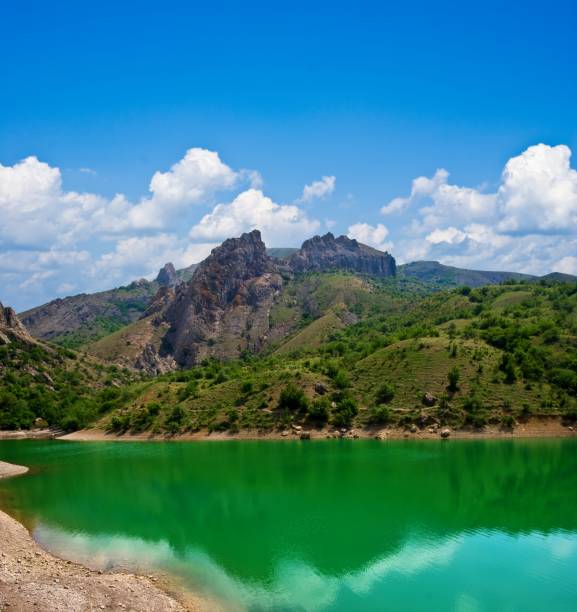 istock emerald lake near a mountain foot 1360513484