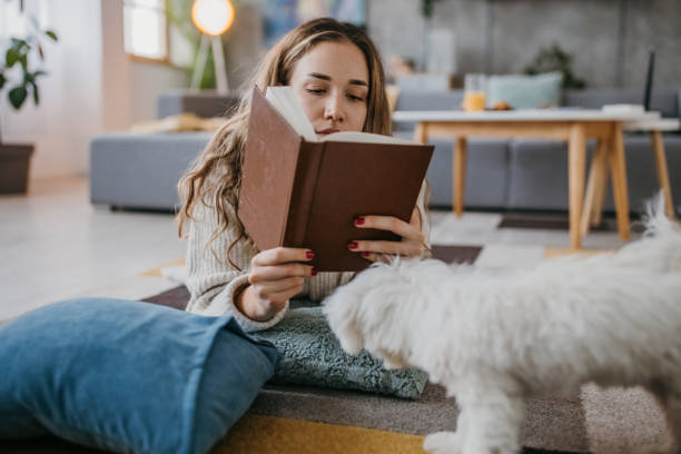 istock Woman reading a book 1360514744