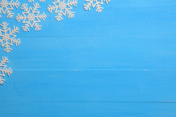 Christmas blue background with snowflakes Christmas blue background with snowflakes for New Years holiday times square new years eve stock pictures, royalty-free photos & images