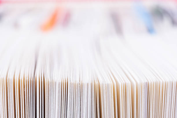 istock Edges of open paper book 1360515908