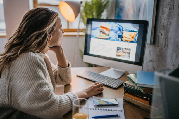 istock Woman reading recipes 1360516789