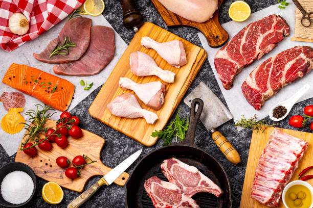 Various types of meat on the counter in a butcher shop. Preparations for barbecue. Food