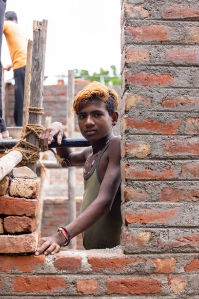 Portrait of indian male labour at construction site stock photo