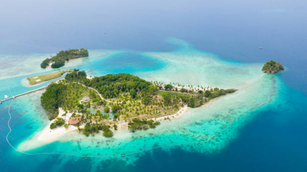 istock Tropical island with beach. Malipano island, Philippines, Samal 1360520349