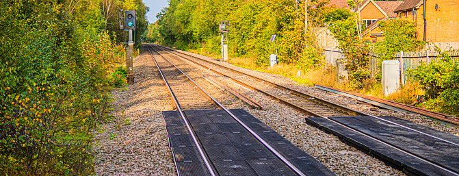 A station England UK. Diesel powered railway line in the English countryside. Station on a sunny day.