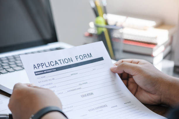 istock business man working on laptop computer and application Form Information for the searching job or fill out personal data for online web job the application form. Employment Concept. 1360521390